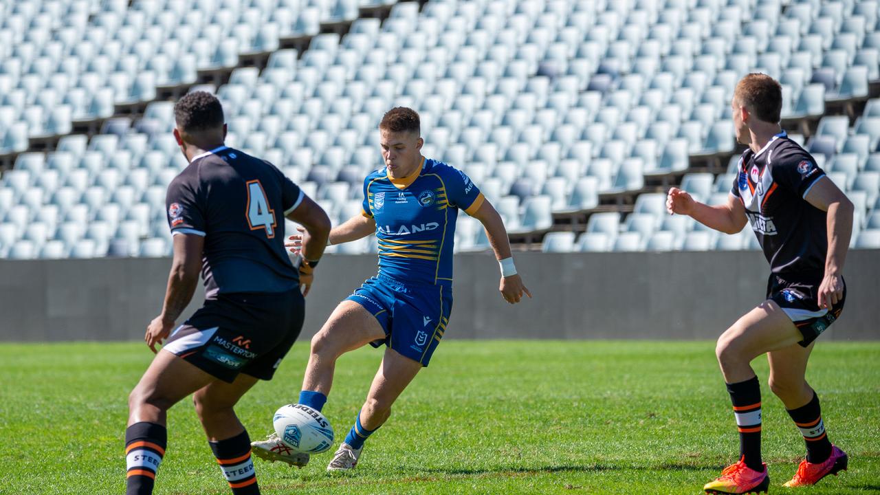 Joshua Lynn kicks for the line playing SG Ball for Parramatta. Picture Thomas Lisson