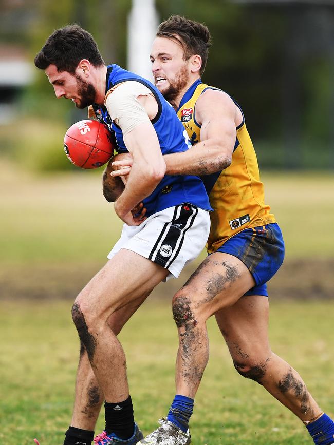 Gaza’s Adrian Stephens tackles Unley Mercedes’ Luke Crocker last season. Picture: AAP/Mark Brake