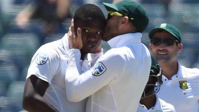 South African captain Faf du Plessis (right) kisses Kagiso Rabada during the first Test win. Picture: AAP.