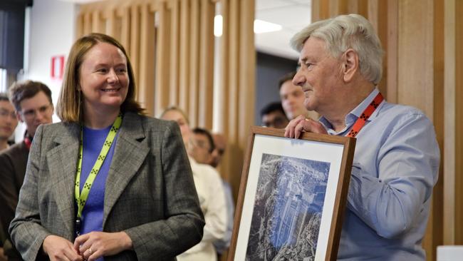 Mike Wallis with Entura Acting CEO Erin van Maanen. Engineer Mike Wallis who has clocked up 60 years with Hydro Tasmania and Entura. Picture: Colin Terry/ Hydro Tasmania