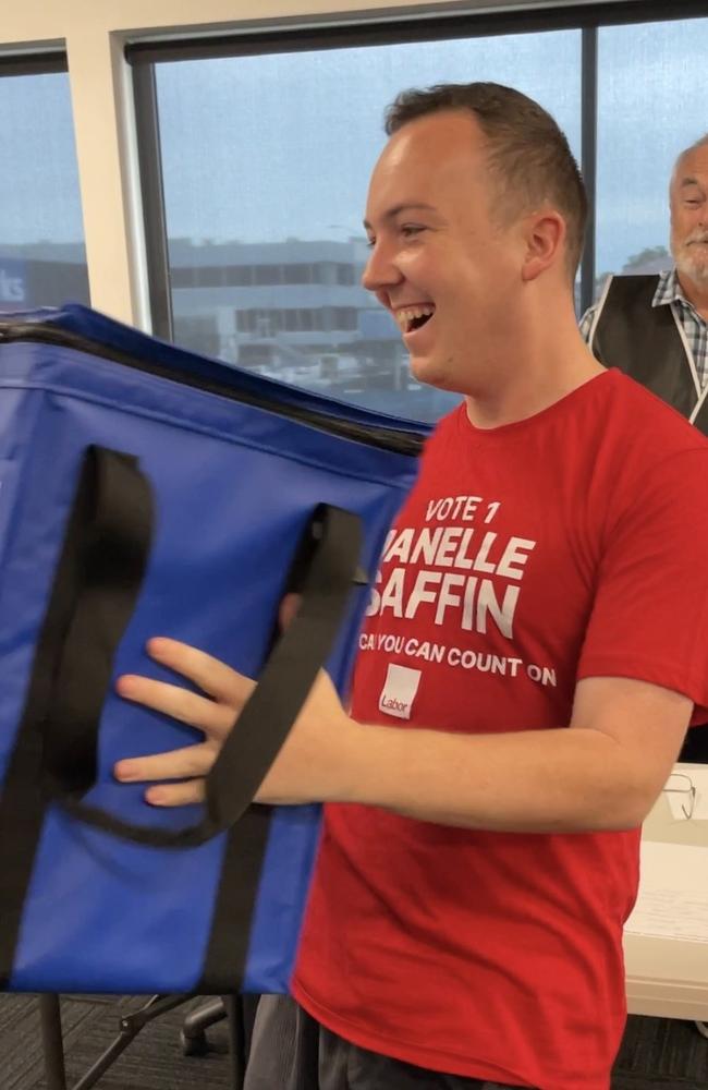 Janelle Saffin's campaign organiser Harry Gregg shaking the ballot box.