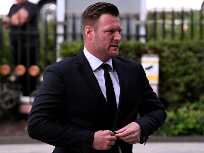 Former Australian tennis player Sam Groth arrives at the state funeral. Picture: AFP