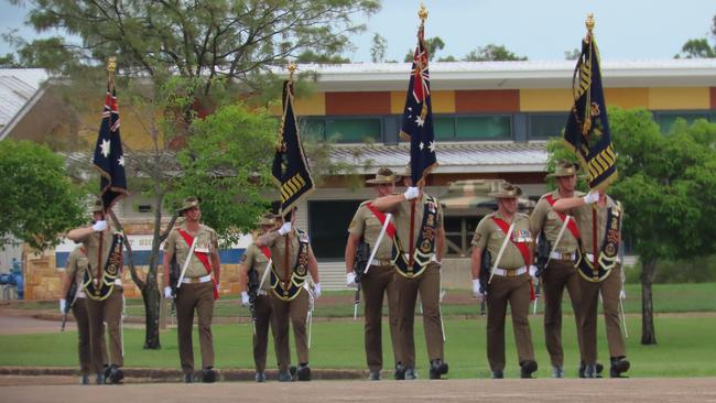 The battalion’s colours are marched on parade. Picture: Harry Brill.