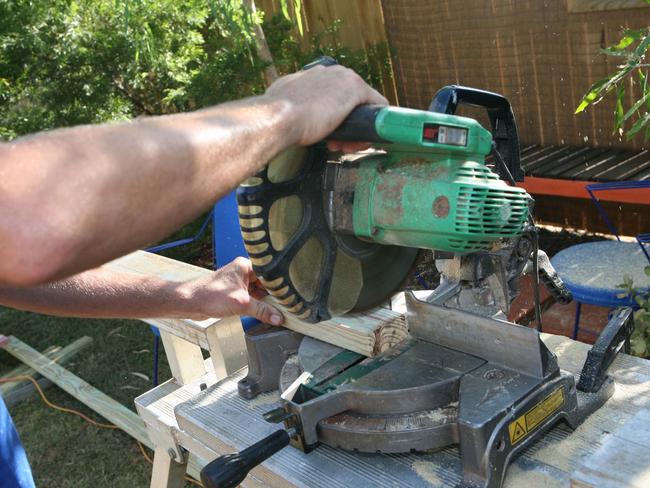 Undated : generic man using a circular saw to cut timber. Pic. Pete Johnson