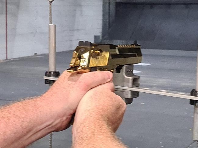 A customer shoots at the newly opened Gold Coast Indoor Shooting Centre. The public shooting gallery is on the same premises as the Southport Indoor Pistol Club at 76 Ferry Rd, Southport on the Gold Coast: Picture: Jodie Munro O'Brien** This photo has been flipped from its original**