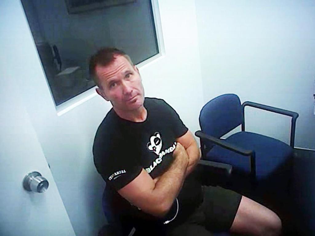 Body-worn footage of Baxter sitting in a shopping centre police beat office where he refused to be interviewed after being asked about being wanted for breaching a domestic violence order.