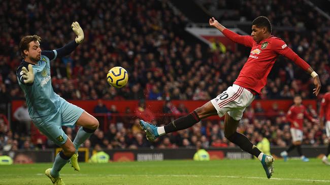 Marcus Rashford fires past Norwich City's Tim Krul to score the opening goal for Manchester United against Norwich City at Old Trafford. Picture: AFP