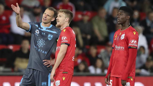 Alexander Wilkinson and Ben Halloran watch the goal by Al Hassan Toure (right) on the big screen, which was later confirmed. Picture: Sarah Reed