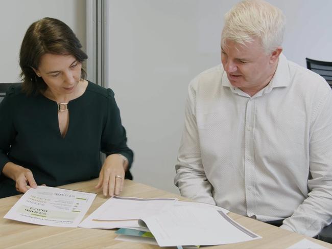 Australian Sugar Milling Council chief executive officer Rachele Sheard reads through the 2020-2021 industry report with director of economics, policy and trade David Rynne. Picture: Supplied