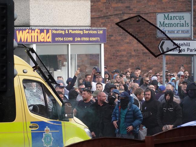 Riot police hold back protesters. Picture: Getty Image