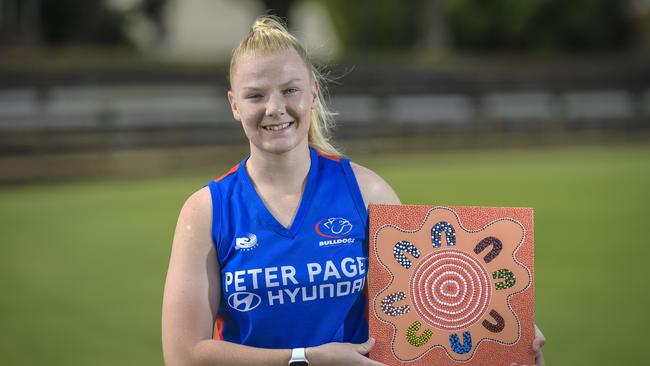 Former Central District player Jessie Sandford with her artwork ahead of Indigenous Round 2022. Picture: Roy VanDerVegt