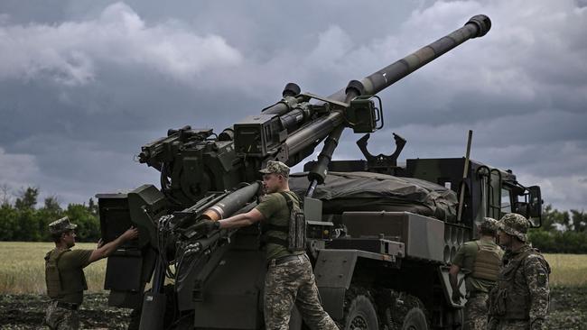 Ukrainian servicemen prepare to fire with a French self-propelled 155mm/52-calibre gun Caesar towards Russian positions at a front line in the eastern Ukrainian region of Donbas. Picture: AFP