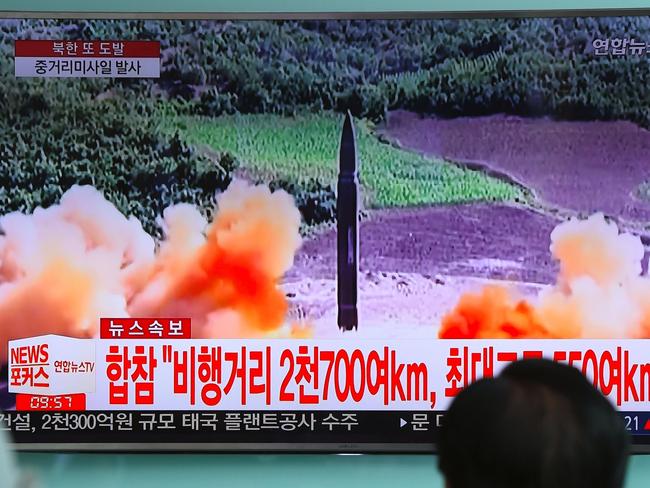 North Korea launched a missile over Japan yesterday — the 13th launch this year that was highly provocative. Picture: AFP PHOTO / JUNG Yeon-Je