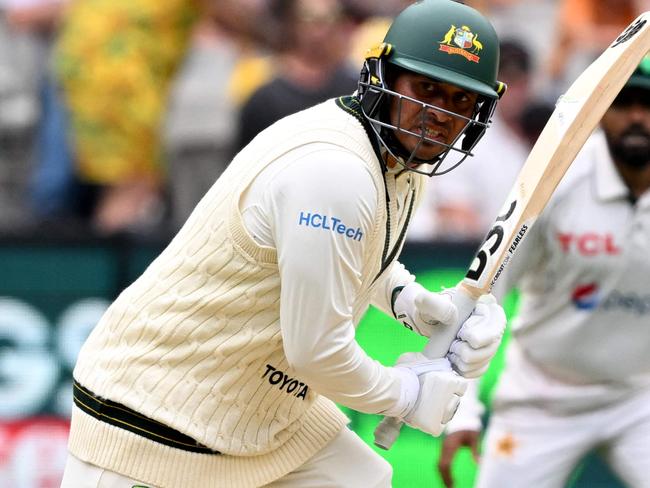 Australia's batsman Usman Khawaja has the names of his children written on his boots on the first day of the second cricket Test match between Australia and Pakistan at the Melbourne Cricket Ground (MCG) in Melbourne on December 26, 2023. (Photo by William WEST / AFP) / --IMAGE RESTRICTED TO EDITORIAL USE - STRICTLY NO COMMERCIAL USE--