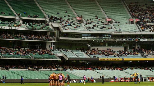 Hawthorn huddles up before a small crowd before its clash against West Coast. Picture: Mark Stewart