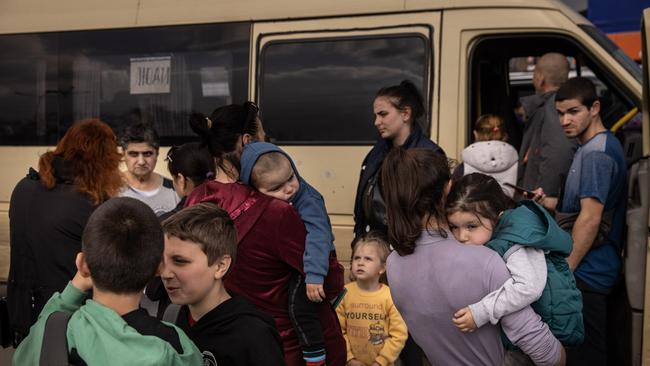 People disembark a vaafter arriving at an evacuation point for people fleeing Mariupol, Melitopol and the surrounding towns under Russian control. Picture: Getty Images