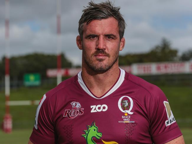 Reds lock Kane Douglas in old style maroon jersey for interstate game.