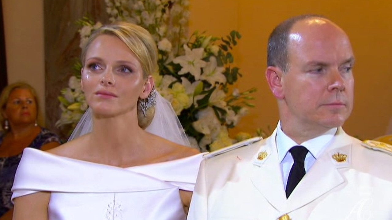 Charlene Princess of Monaco with tears on her cheek during the wedding service in the chapel of the Sainte Devote Church to Prince Albert II of Monaco, right.