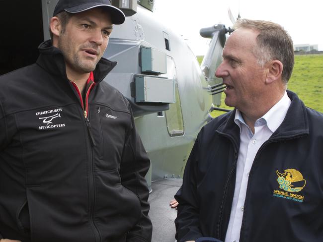 New Zealand Prime Minister John Key, right, talks with former All Blacks captain Richie McCaw during a visit to Kaikoura following an earthquake in New Zealand, Monday, Nov. 14, 2106. A powerful earthquake that rocked New Zealand on Monday triggered landslides and a small tsunami, cracked apart roads and homes and left two people dead, but largely spared the country the devastation it saw five years ago when a deadly earthquake struck the same region. (Mark Mitchell/New Zealand Herald Pool Photo via AP)