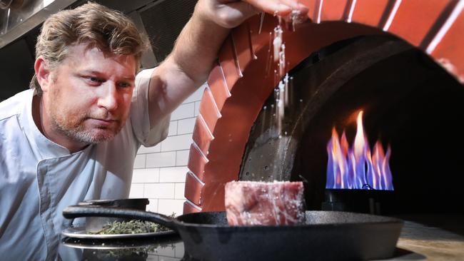 Owner Daniel Ridgway seasons a steak in the new and improved venue Little Truffle. The restaurant is reopening after closing late last year for renovations. Picture Glenn Hampson