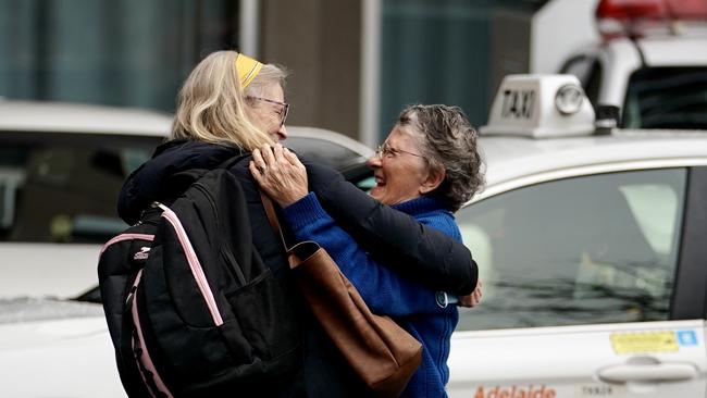 Family members reunite after coming out of quarantine at the Pullman Hotel on Saturday morning. Photo: MIKE BURTON