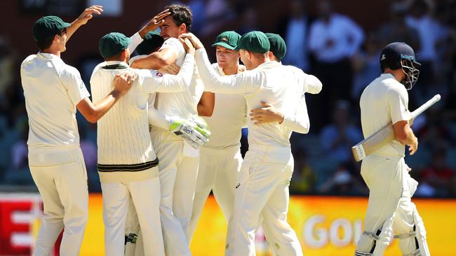 Australia celebrates victory after Mitchell Starc of Australia took the wicket of Jonny Bairstow at Adelaide Oval