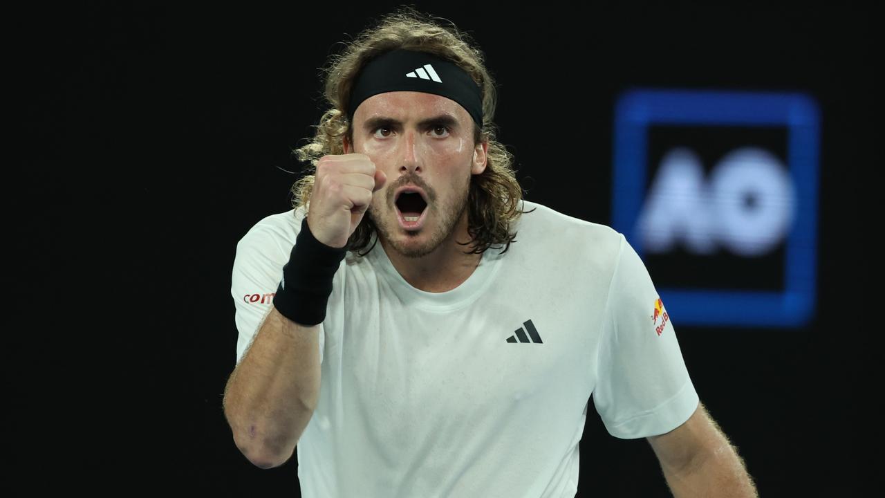 MELBOURNE, AUSTRALIA - JANUARY 22: Stefanos Tsitsipas of Greece celebrates after winning match point during the fourth round singles match against Jannik Sinner of Italy during day seven of the 2023 Australian Open at Melbourne Park on January 22, 2023 in Melbourne, Australia. (Photo by Lintao Zhang/Getty Images)