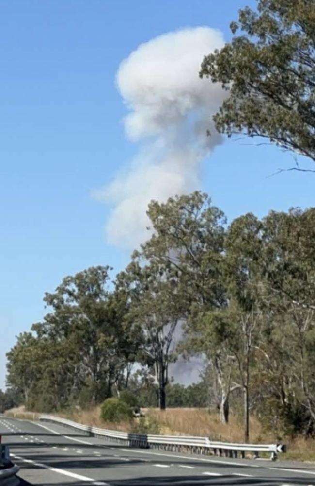 A huge plume of smoke can be seen rising above the Bruce Highway after the explosion of a truck carrying ammonium nitrate. Photo Kerri-Anne Mesner