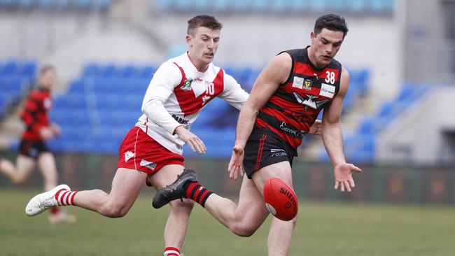 James Bealey (Clarence) and Cambell Hooker (Lauderdale) do battle in the preliminary final. Picture: Nikki Davis-Jones