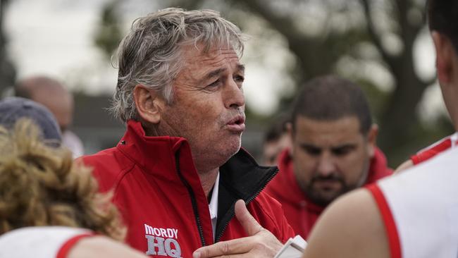 Mordialloc coach Brendon Moore speaking to his players last season. Picture: Valeriu Campan