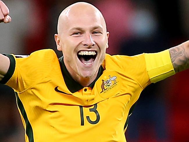 DOHA, QATAR - JUNE 13: Aaron Mooy of Australia celebrates their sides victory after a penalty shoot out following the 2022 FIFA World Cup Playoff match between Australia Socceroos and Peru at Ahmad Bin Ali Stadium on June 13, 2022 in Doha, Qatar. (Photo by Mohamed Farag/Getty Images)