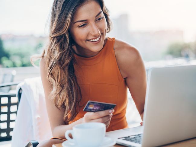 Young woman with credit card and laptopWomen is shopping online with mobile phone.ASOS is an ambitious brand that moves fast and Facebook is a great place to find and connect with mobile-savvy 20-somethingspicture supplied