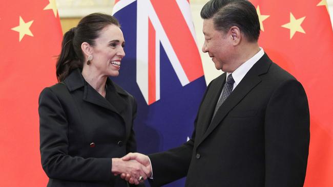 Xi Jinping (R) shakes hands with New Zealand's Prime Minister Jacinda Ardern before their meeting at the Great Hall of the People in Beijing in 2019.