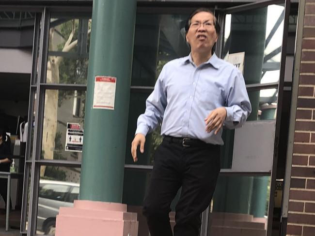 Homebush dentist Vi Minh Lam, 53, leaving Burwood Local Court after facing charges of possessing child porn and recording intimate images without consent.