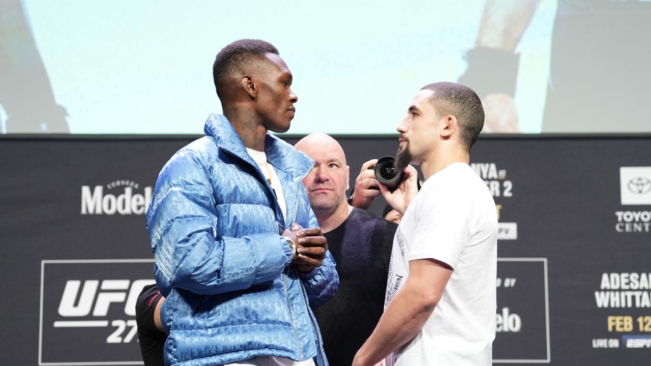 HOUSTON, TEXAS – FEBRUARY 10: (L-R) Opponents Israel Adesanya of Nigeria and Robert Whittaker of Australia face off during the UFC 271 press conference at George R. Brown Convention Center on February 10, 2022 in Houston, Texas. (Photo by Josh Hedges/Zuffa LLC)