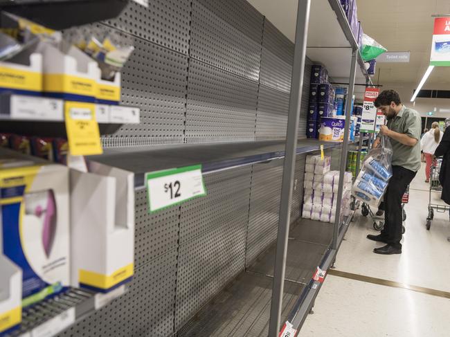 Empty shelves are seen at a Woolworths supermarket at The Range Shopping Centre ahead of Greater Brisbane’s snap three-day lockdown. Picture: Kevin Farmer