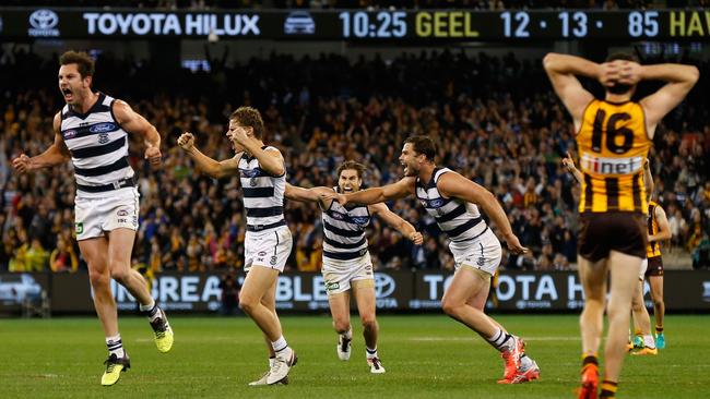 Cats players celebrate after Isaac Smith of the Hawks misses a shot on goal after the siren to lose the match during the 2016 AFL Second Qualifying Final match between the Geelong Cats and the Hawthorn Hawks.