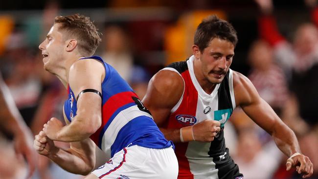 BRISBANE, AUSTRALIA - OCTOBER 03: Ben Long of the Saints and Lachie Hunter of the Bulldogs in action during the 2020 AFL Second Elimination Final match between the St Kilda Saints and the Western Bulldogs at The Gabba on October 03, 2020 in Brisbane, Australia. (Photo by Michael Willson/AFL Photos via Getty Images)