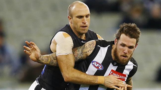 AFL Round 15 Collingwood v Carlton at the MCG.  Dane Swan and Chris Judd compete for the loose footy . Pic: Michael Klein. Sunday June 29, 2014.