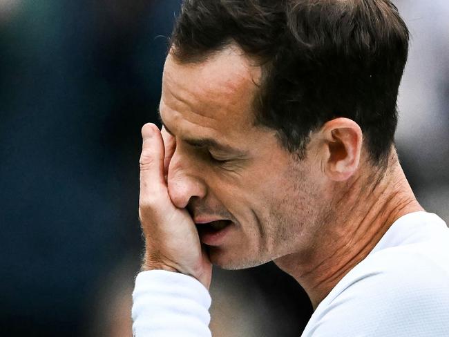 Britain's Andy Murray cries as he delivers a speech at the end of his men's doubles tennis match with his brother Britain's Jamie Murray, during a farewell ceremony to celebrate his last Wimbledon, on the fourth day of the 2024 Wimbledon Championships at The All England Lawn Tennis and Croquet Club in Wimbledon, southwest London, on July 4, 2024. (Photo by Ben Stansall / AFP) / RESTRICTED TO EDITORIAL USE