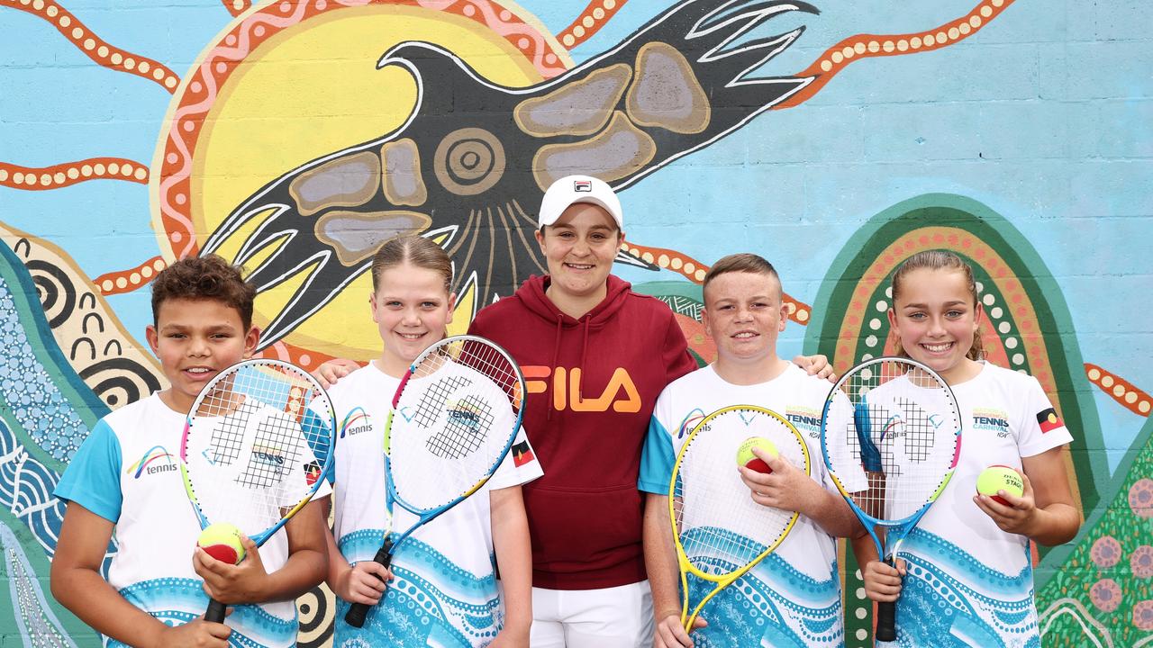 Ash Barty poses with kids during the National Indigenous Tennis Carnival launch in Newcastle. Picture; Matt King/Getty Images for Tennis Australia