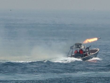 An Iranian speedboat fires a missile during exercises.