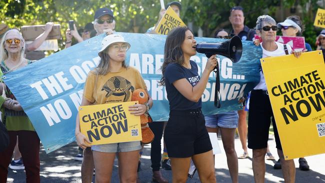 Cairns and Far North Environment Centre community campaigner Bronwyn Opie and Australian Marine Conservation Society Great Barrier Reef community campaigner Tanya Murphy lead climate change protesters in chants on the street in front of the regional sitting of Queensland parliament, held at the Cairns Convention Centre. Picture: Brendan Radke