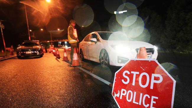 1am August 8 2020, Gold Coast Highway Coolanagatta Queensland - Queensland Police Officers with the assistance of The Australian Army stop all traffic into Queensland for checks at 1am on QLD/NSW border crossing due to increased lockdown of the State of QueenslandScott Powick Newscorp