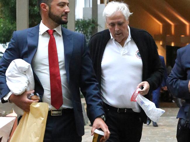 Federal Court Brisbane Sittings Staff with pillow and breathing aid arrive with Clive Palmer holds sick bag arrives at court after lunch Photographer Philip Norrish NO BY LINE