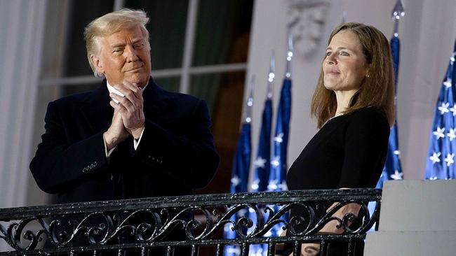 Then-US President Donald Trump stands with newly sworn in US Supreme Court Associate Justice Amy Coney Barrett in October, 2020. Picture: Tasos Katopodis/Getty Images/AFP