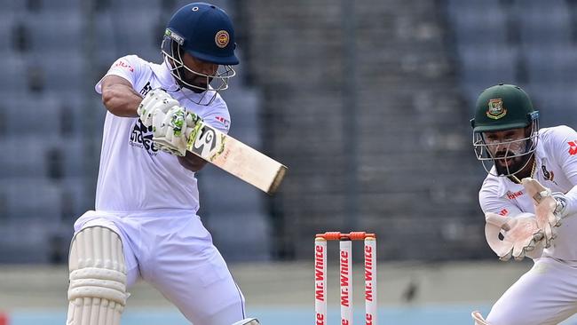 Sri Lankan captain Dimuth Karunaratne plays a shot. Photo by Munir uz ZAMAN/AFP