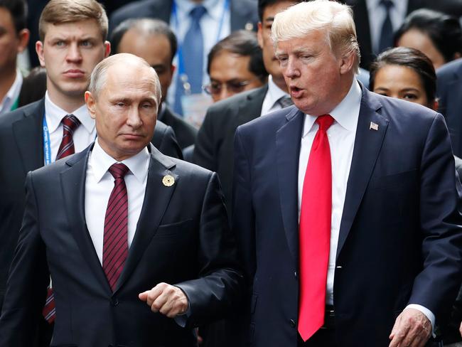 Mr Trump, pictured with Russia’s President Vladimir Putin, has dismissed claims of Russian collusion during the 2016 election campaign. Picture: Jorge Silva/AFP
