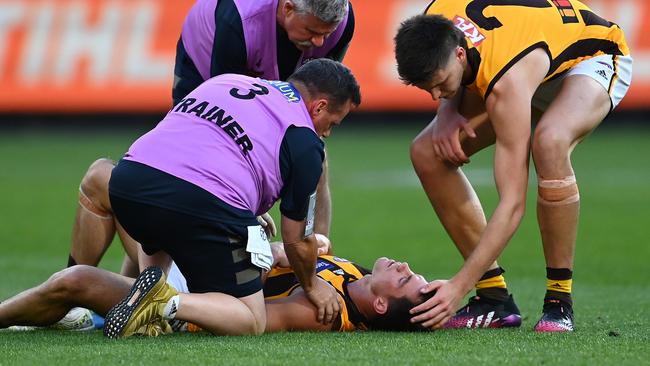 Hawthorn’s Jaeger O'Meara was concussed after a collision with Lachie Plowman. Picture: Quinn Rooney/Getty Images