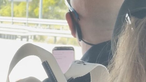 The driver of the bus looking at his phone while driving on the Gateway Mwy, Boondall on Friday, February 23. Picture: Supplied